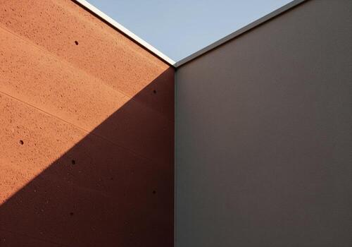 Modern architectural abstract of a building corner with sunlight and shadow photo