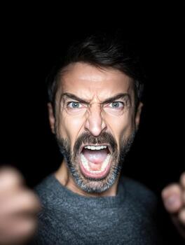 Angry man expressing emotion portrait intense mood photo