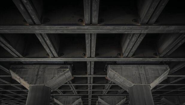 View of a Concrete Ceiling with Support Columns Beneath it photo