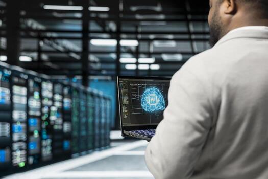 Close up of system administrator programming in AI data center housing advanced equipment used for machine learning training. Server hub worker running code to upgrade artificial intelligence tech photo