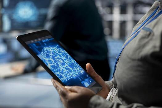Close up of tablet used by data center computer scientist to upgrade storage devices for minimal latency in AI workloads. IT specialist using device in high tech server hub to build neural networks photo