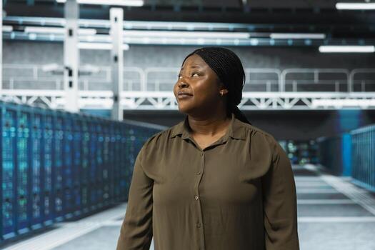 Engineer working in data center with rigs layout supporting business technology needs. Server farm employee doing checkup, ensuring infrastructure works at optimum performance for smooth operations photo