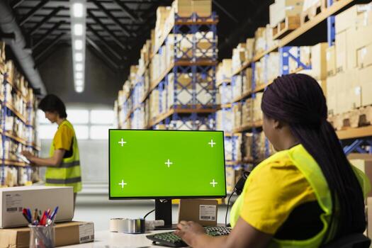 Warehouse worker in a hi-vis vest uses copy space display with technology of shipping software, packaging systems and inventory management tools. automation in e-commerce logistics. photo