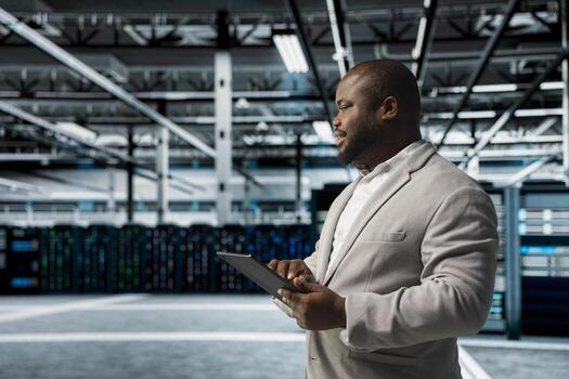 Data center admin updating systems to keeps performance up and protect servers from easily exploitable software vulnerabilities. Worker looking for errors causing servers to slow down photo