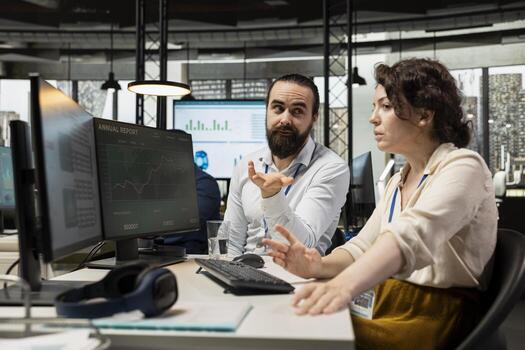 Executive team working together on report writing at the workstation, collaborating on building a new development strategy. Reviewing insights to enhance efficiency and progress. photo