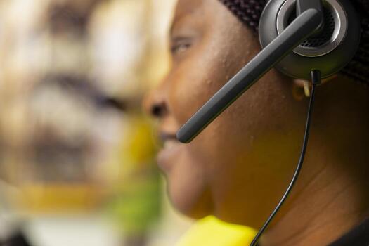 Close up of customer support worker handles e-commerce order issues on a call, responding to clients and helping with information about shipment delays or wrong delivery addresses. photo