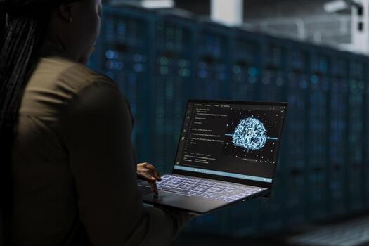 Developer uses AI neural network to do checkup on data center electronics processing datasets. Server hub worker uses machine learning to do backup on gear used by cloud storage hosting companies photo