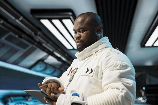 Close up of cosmonaut in starship navigating orbital trajectory using device, doing galaxy expedition for future of mankind. Orbital station crew member mapping unknown worlds using tablet photo