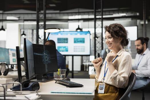 Cheerful businesswoman being proud of good infographics with AI tools, using artificial intelligence for optimization and goals achievement in a multinational company. Neural networks. photo