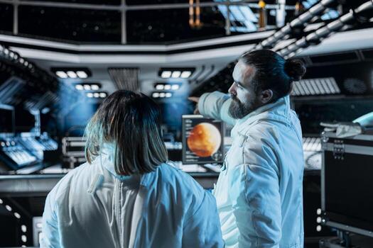 Team of cosmonauts doing brainstorming during Mars expedition for future of mankind. Teamworking astronauts talking in spaceship, exploring red planet to support human life beyond Earth photo