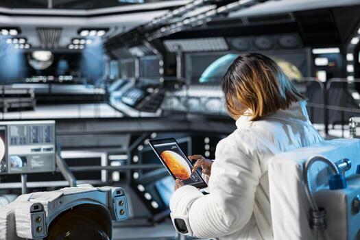 Astronaut checks tablet before landing spaceship on Mars to support mission exploring life beyond Earth. Crew prepares to study red planet surface and test future human survival in deep space photo