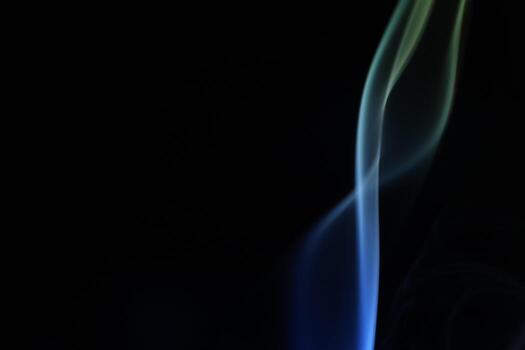 Blue and yellow coloured smoke shape, minimalistic background photo