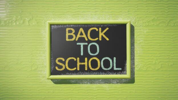 Back to School Message Written on a Chalkboard Attached to Green Wall photo