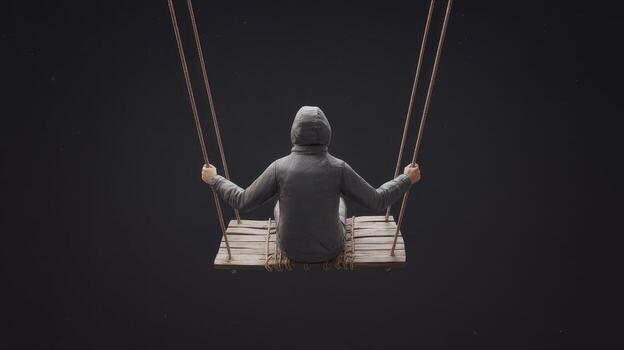 Figure With Hood Swinging on Wood Swing in Darkness Viewed From Behind photo