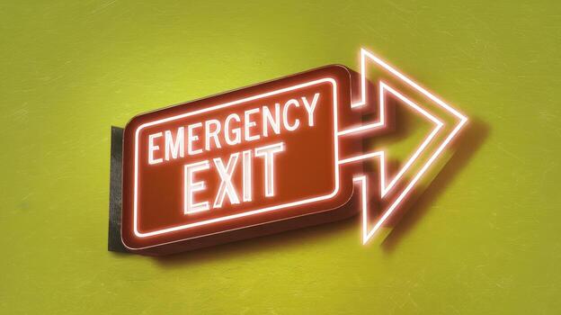 Emergency Exit Sign With Neon Arrow on a Yellow Wall photo