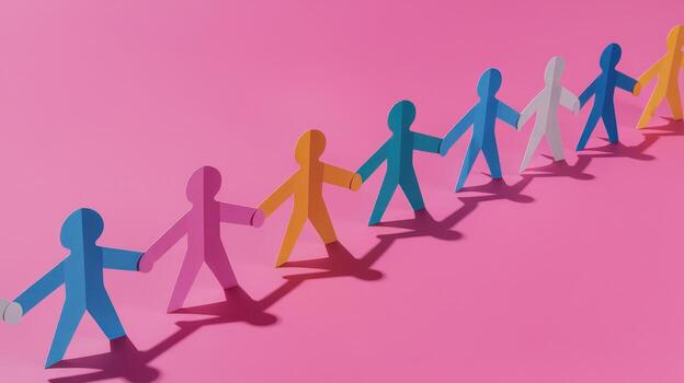 Colorful Paper People Holding Hands on Pink Background Representing Unity photo