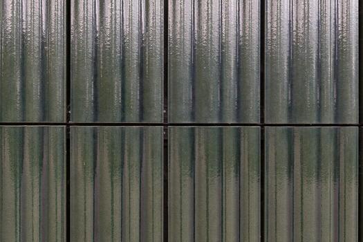 Metallic textures and reflections create a captivating pattern in the urban landscape during a cloudy afternoon photo