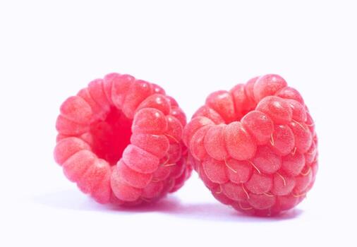 Ripe raspberryes on a white photo