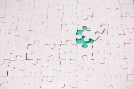 Conceptual White Jigsaw Puzzle with a Missing Piece, Emphasizing Completion and Problem Solving, Representing Challenges and Solutions photo