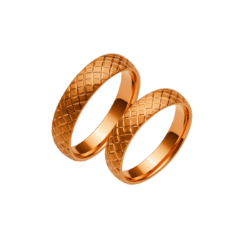 un dos elegante oro anillos con texturizado patrón, simbolizando amor y compromiso, son desplegado en contra transparencia antecedentes. intrincado diseño agrega toque de sofisticación y lujo png