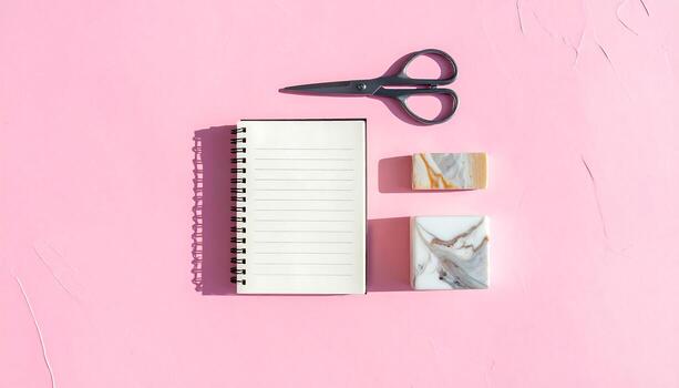 Minimalist Flat Lay Notebook Scissors and Marble Objects on Pink Background photo