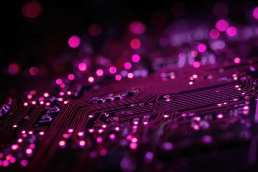 Close-up of illuminated circuit board with pink highlights photo