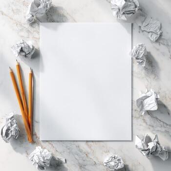 Blank paper, crumpled paper and pencils on marble surface photo