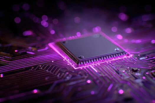 Close-up of a glowing microprocessor on a circuit board photo
