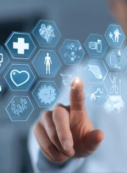 Hand touching medical icons on a digital interface photo