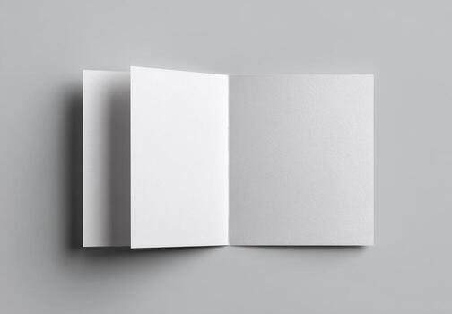 Open blank brochure on gray background photo