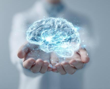 A person's hands hold a digital, light-blue brain image photo