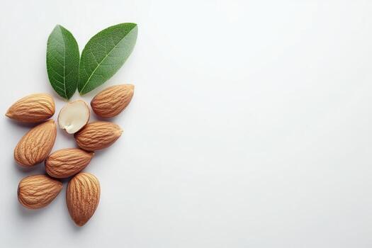 Almendras y hojas en blanco antecedentes foto