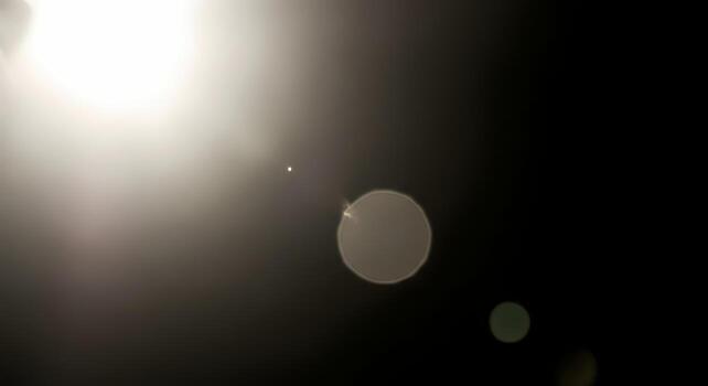 Abstract Bokeh Lights Overlay Background with Bright Lens Flare and Glow Effect Copy Space for Text and Design photo