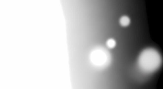 Abstract bokeh background with bright glowing circles of light on dark gradient texture photo