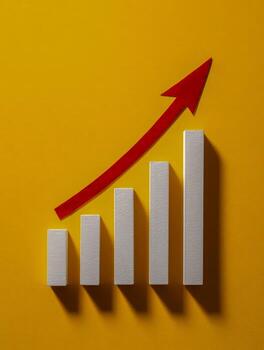 Conceptual image of a five-bar growth chart with a red arrow showing upward trend on a vibrant yellow background symbolizing business success and progress photo
