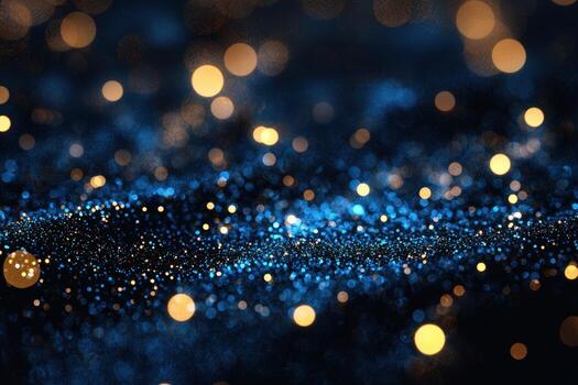 Abstract blue and gold bokeh lights with sparkling particles in a dark background photo