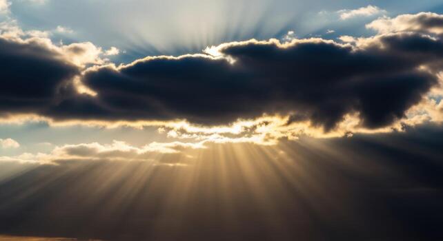 Sunbeams shining through clouds in the sky photo