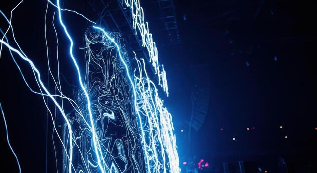 A man is standing in front of a large light display photo