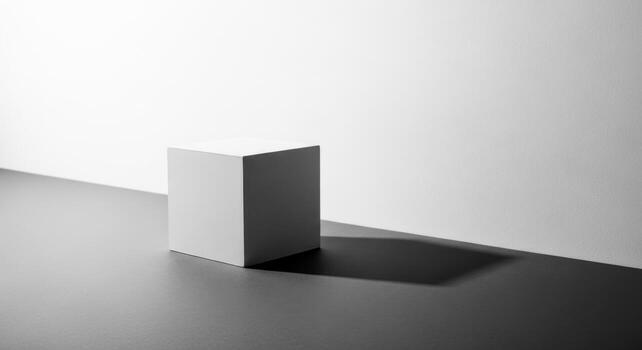 un blanco cubo sentado en un mesa en frente de un pared foto