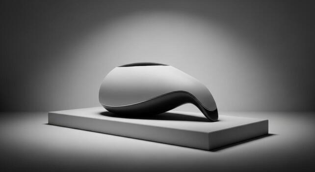 A black and white photo of a vase on a table