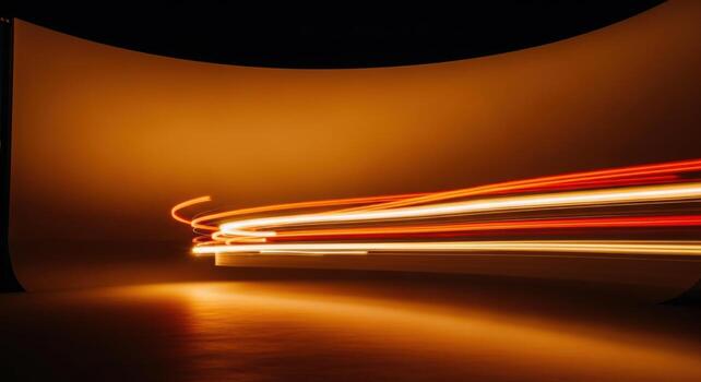 Light trails of a car passing through a dark room photo