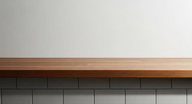 Clean medium toned wooden countertop with visible wood grain texture over tiled wall photo