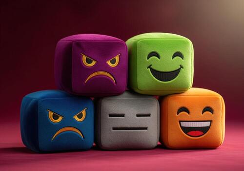 Colorful plush velvet cubes displaying diverse emotions and moods on a rich red surface photo