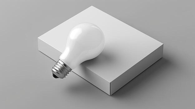 Light Bulb Resting on Simple Square White Base in Minimalist Style photo