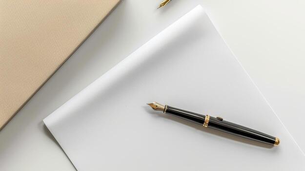 A fountain pen and a notebook on a white surface photo