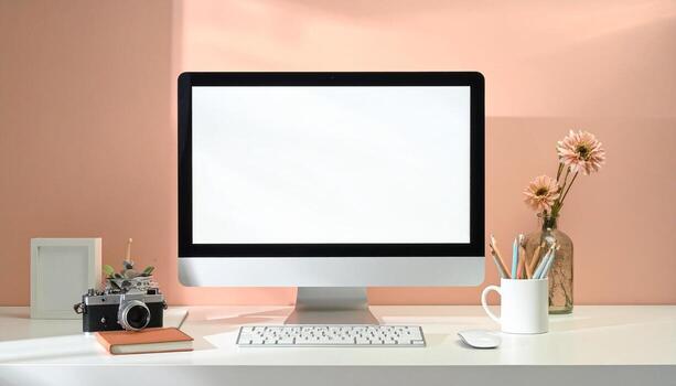 Minimalist Workspace with Computer and Camera on White Desk. photo