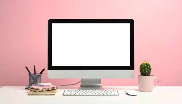 Minimalist Workspace with Computer and Pink Backdrop. photo