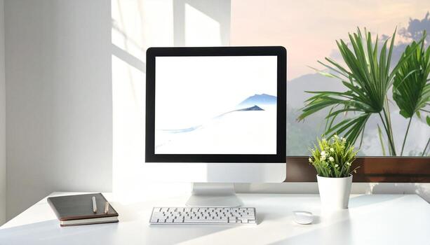 Minimalist Workspace with Computer Plants and Natural Light. photo