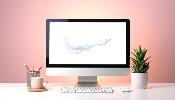 Modern workspace with computer plant and coffee cup on a white desk. photo