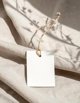 Blank Tag on Linen Fabric with Shadow Overlay. photo